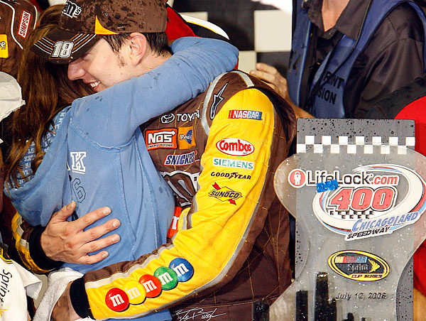 Kyle Busch, right, celebrates