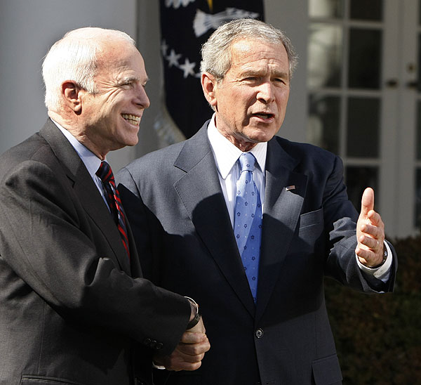 President Bush and Republican nominee in waiting John McCain shake