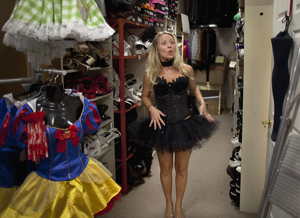 Jennifer Russell reacts to the black swan costume she tried on at Echoes of
