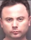 The Rev. Piotr Bialkowski was charged with domestic assault on Nov. 28.
