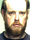 Michael Z. Erickson is charged with two counts of threatening to bomb a building.