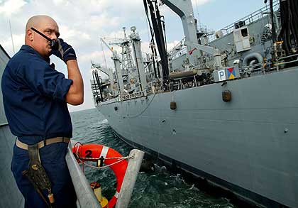The Australian-built HSV 2 Swift is being considered by the Navy as a possible solution to its need for a high-speed combat ship. Four diesel engines drive four water jets that give the aluminum-hulled Swift a top speed of 53 mph. It was tied up at Naval Station Norfolk Tuesday after a demonstration.
 
 
 
 
 
