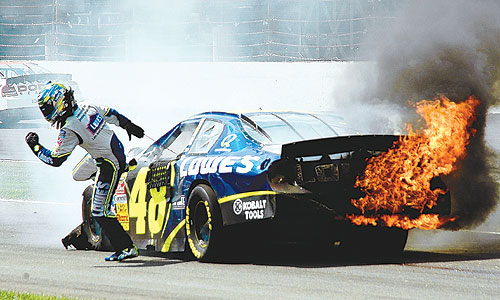 Jimmie Johnson leaps from his