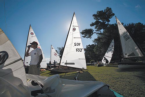 Joe Courter, left, and others prepare for the Classic Moth Boat National Championship on Sunday. The moth boat was created in Elizabeth City in 1929 by Capt. Joel Van Sant. For the past 19 years, the national competition has been held blocks away from the shipyard where the first moth boat was built.    